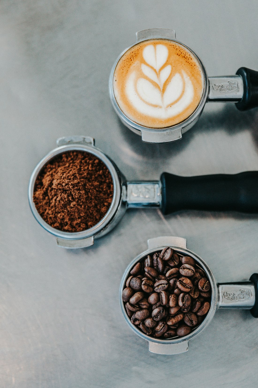 Stainless portafilters with fresh ground coffee