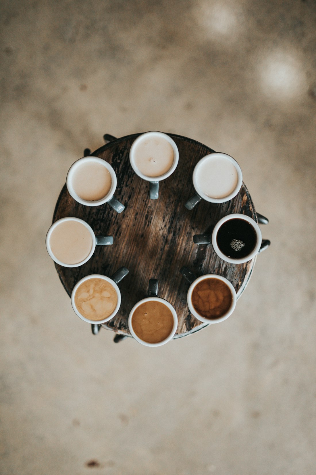 A round tray of assorted coffee drinks